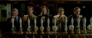 Movie still from “The World's End” (2013), directed by Edgar Wright – A group of men standing in front of a row of beer taps; Medium shot, Low angle