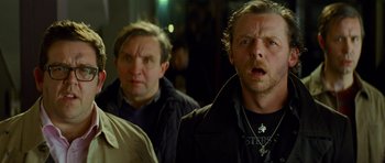 Movie still from “The World's End” (2013), directed by Edgar Wright – A group of men standing next to each other; Close Up shot, Low angle