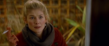 Movie still from “The World's End” (2013), directed by Edgar Wright – A person wearing a red jacket; Close Up shot, Over the shoulder angle