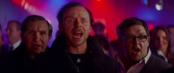 Movie still from “The World's End” (2013), directed by Edgar Wright – A person in a crowd; Close Up shot, Over the shoulder angle