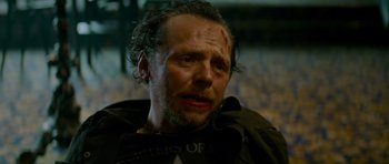 Movie still from “The World's End” (2013), directed by Edgar Wright – A person wearing a black shirt; Close Up shot, Over the shoulder angle