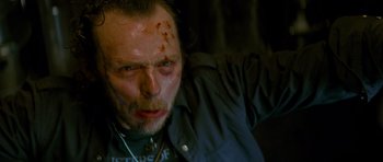 Movie still from “The World's End” (2013), directed by Edgar Wright – A person with blood all over his face; Close Up shot, Low angle