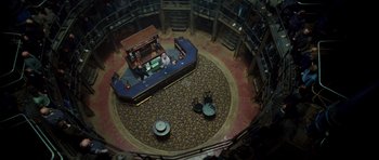 Movie still from “The World's End” (2013), directed by Edgar Wright – An overhead view of a library with a desk and chairs; Extreme Wide shot, Overhead angle