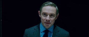 Movie still from “The World's End” (2013), directed by Edgar Wright – A person wearing a suit and tie; Close Up shot, Over the shoulder angle
