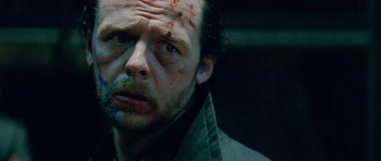 Movie still from “The World's End” (2013), directed by Edgar Wright – A person with blood all over his face; Close Up shot, Over the shoulder angle