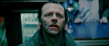 Movie still from “The World's End” (2013), directed by Edgar Wright – A person with blood on his face; Close Up shot, Low angle