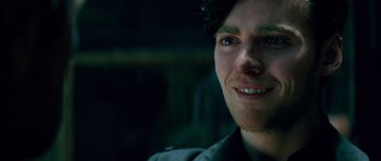 Movie still from “The World's End” (2013), directed by Edgar Wright – A man smiling for the camera; Close Up shot, Over the shoulder angle
