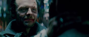 Movie still from “The World's End” (2013), directed by Edgar Wright – A person with blood on his face; Close Up shot, Over the shoulder angle