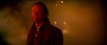 Movie still from “The World's End” (2013), directed by Edgar Wright – A man in a brown jacket is standing in a room; Close Up shot, Over the shoulder angle