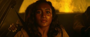 Movie still from “There's Someone Inside Your House” (2021), directed by Patrick Brice – A woman's face in the dark; Close Up shot, High angle