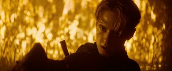 Movie still from “There's Someone Inside Your House” (2021), directed by Patrick Brice – A man with a pipe in his mouth; Close Up shot, Over the shoulder angle