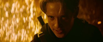 Movie still from “There's Someone Inside Your House” (2021), directed by Patrick Brice – A person holding a sword; Close Up shot, Low angle