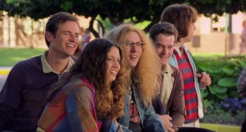Movie still from “There's Something About Mary” (1998), directed by Bobby Farrelly – A group of people sitting next to each other; Medium shot, Low angle