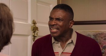 Movie still from “There's Something About Mary” (1998), directed by Bobby Farrelly – A person wearing a sweater; Close Up shot, High angle