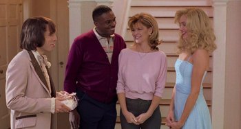 Movie still from “There's Something About Mary” (1998), directed by Bobby Farrelly – A group of people that are standing up; Medium shot, Over the shoulder angle