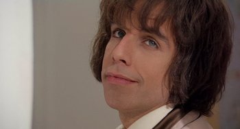 Movie still from “There's Something About Mary” (1998), directed by Bobby Farrelly – A person with long brown hair; Close Up shot, Low angle