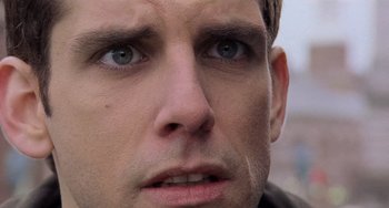 Movie still from “There's Something About Mary” (1998), directed by Bobby Farrelly – A man's face with blue eyes; Close Up shot, Low angle