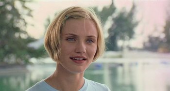 Movie still from “There's Something About Mary” (1998), directed by Bobby Farrelly – A person with short blonde hair; Close Up shot, Over the shoulder angle