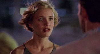 Movie still from “There's Something About Mary” (1998), directed by Bobby Farrelly – A person with short blonde hair; Close Up shot, Over the shoulder angle
