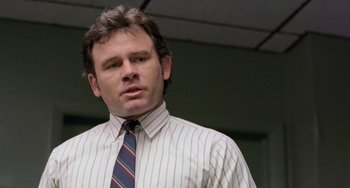 Movie still from “There's Something About Mary” (1998), directed by Bobby Farrelly – A person wearing a shirt and a tie; Close Up shot, Low angle