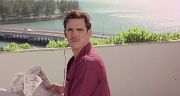 Movie still from “There's Something About Mary” (1998), directed by Bobby Farrelly – A man with a mustache and a red shirt; Close Up shot, Low angle