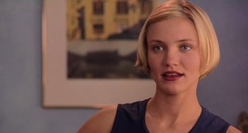 Movie still from “There's Something About Mary” (1998), directed by Bobby Farrelly – A person with short blonde hair; Close Up shot, Over the shoulder angle