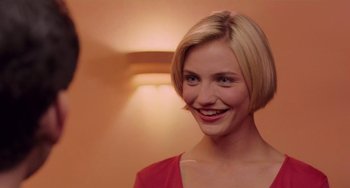 Movie still from “There's Something About Mary” (1998), directed by Bobby Farrelly – A person with short blonde hair; Close Up shot, Over the shoulder angle