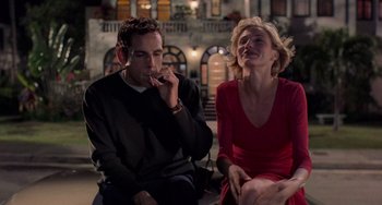 Movie still from “There's Something About Mary” (1998), directed by Bobby Farrelly – A man and a woman sitting next to each other; Medium shot, Low angle