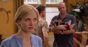 Movie still from “There's Something About Mary” (1998), directed by Bobby Farrelly – A woman standing in front of a man holding a stuffed animal; Close Up shot, Over the shoulder angle