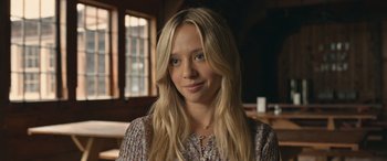 Movie still from “They/Them” (2022), directed by John Logan – A person with long blonde hair; Close Up shot, Over the shoulder angle