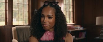 Movie still from “They/Them” (2022), directed by John Logan – A person wearing a pink shirt; Close Up shot, Over the shoulder angle