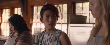 Movie still from “They/Them” (2022), directed by John Logan – A man with red hair is standing in a kitchen; Close Up shot, Over the shoulder angle