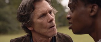 Movie still from “They/Them” (2022), directed by John Logan – A person talking to another person; Close Up shot, Over the shoulder angle