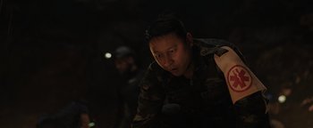 Movie still from “Thirteen Lives” (2022), directed by Ron Howard – A man in a military uniform looking at the camera; Close Up shot, Over the shoulder angle