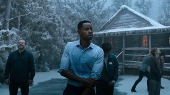 Movie still from “Escape Room” (2019), directed by Adam Robitel – A man holding a baseball bat while standing next to a woman; Medium shot, Low angle