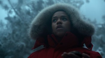 Movie still from “Escape Room” (2019), directed by Adam Robitel – A young person wearing a red coat with a fur hood; Close Up shot, Low angle