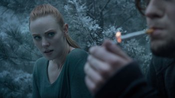 Movie still from “Escape Room” (2019), directed by Adam Robitel – A woman is smoking a cigarette while another woman looks on; Close Up shot, Over the shoulder angle