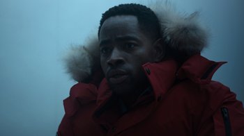 Movie still from “Escape Room” (2019), directed by Adam Robitel – A person wearing a red jacket; Close Up shot, Over the shoulder angle
