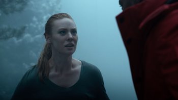 Movie still from “Escape Room” (2019), directed by Adam Robitel – A woman in a black shirt is looking at a man in a red jacket; Close Up shot, Over the shoulder angle