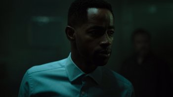 Movie still from “Escape Room” (2019), directed by Adam Robitel – A man wearing a dress shirt and a tie; Close Up shot, Low angle