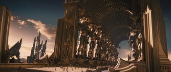 Movie still from “Thor” (2011), directed by Kenneth Branagh – An image of a large sculpture in the middle of a city; Extreme Wide shot, Low angle