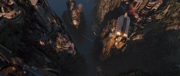 Movie still from “Thor” (2011), directed by Kenneth Branagh – An aerial view of a river and some buildings; Extreme Wide shot, Overhead angle