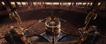 Movie still from “Thor” (2011), directed by Kenneth Branagh – An aerial view of a large crowd of people in an arena; Extreme Wide shot, Overhead angle