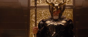 Movie still from “Thor” (2011), directed by Kenneth Branagh – A man dressed as thor holding a golden staff; Close Up shot, Low angle