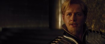 Movie still from “Thor” (2011), directed by Kenneth Branagh – A person wearing a suit and tie; Close Up shot, Over the shoulder angle