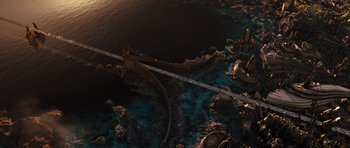 Movie still from “Thor” (2011), directed by Kenneth Branagh – An aerial view of the ocean and a bridge; Extreme Wide shot, Overhead angle