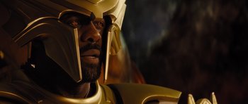 Movie still from “Thor” (2011), directed by Kenneth Branagh – A person wearing a gold helmet; Close Up shot, Low angle