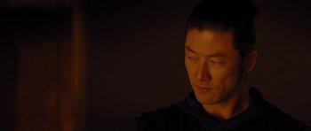 Movie still from “Thor” (2011), directed by Kenneth Branagh – A young man is looking down at his face in the dark; Close Up shot, Over the shoulder angle