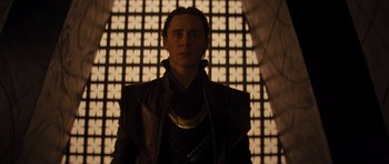 Movie still from “Thor” (2011), directed by Kenneth Branagh – A person wearing a suit; Medium shot, Low angle