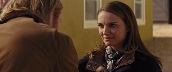 Movie still from “Thor” (2011), directed by Kenneth Branagh – A woman in a brown jacket is talking to another woman; Close Up shot, Over the shoulder angle